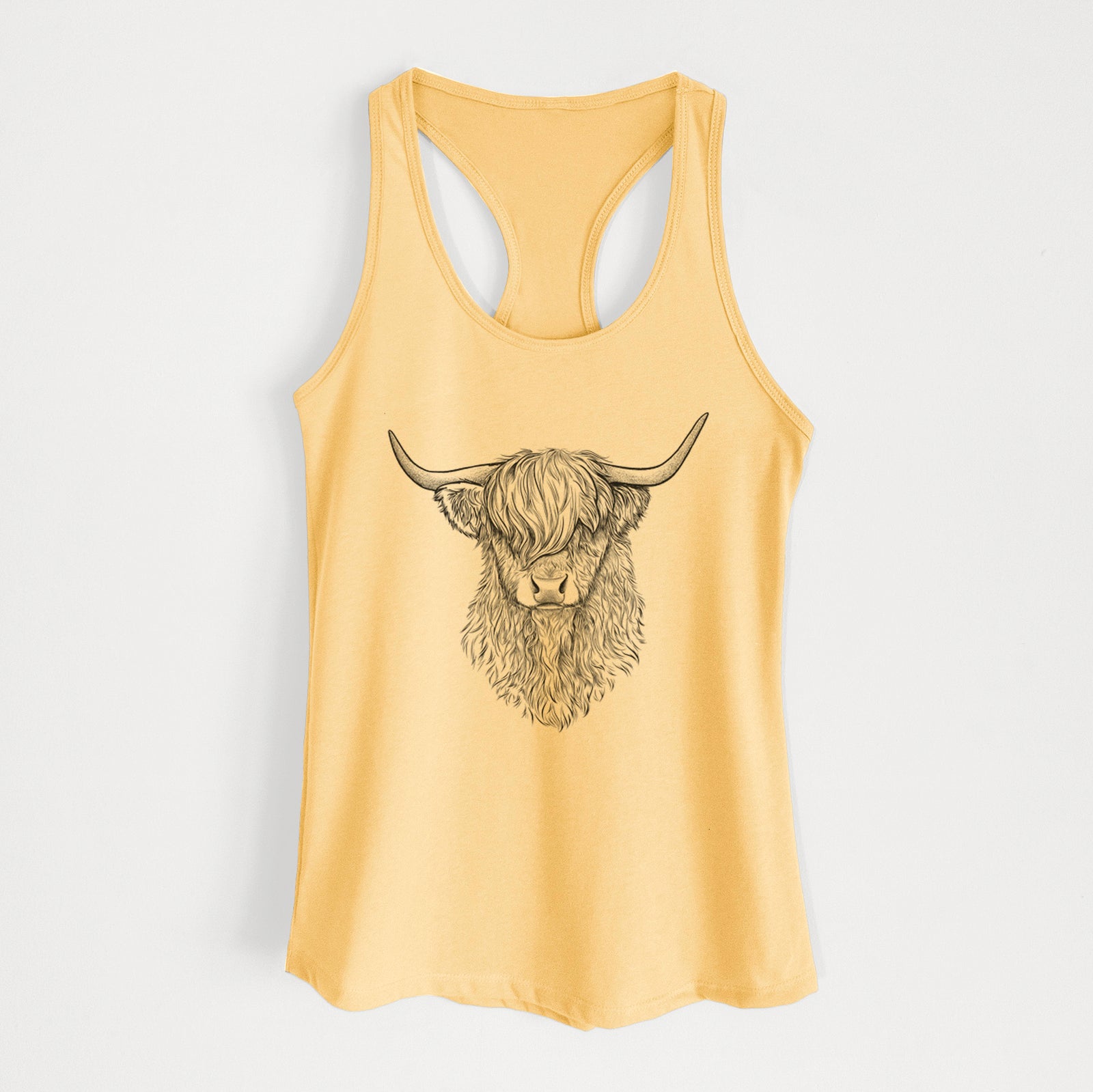 Banana cream women's racerback tank top laid flat, printed with a detailed black ink portrait of a shaggy highland cow with long curved horns.