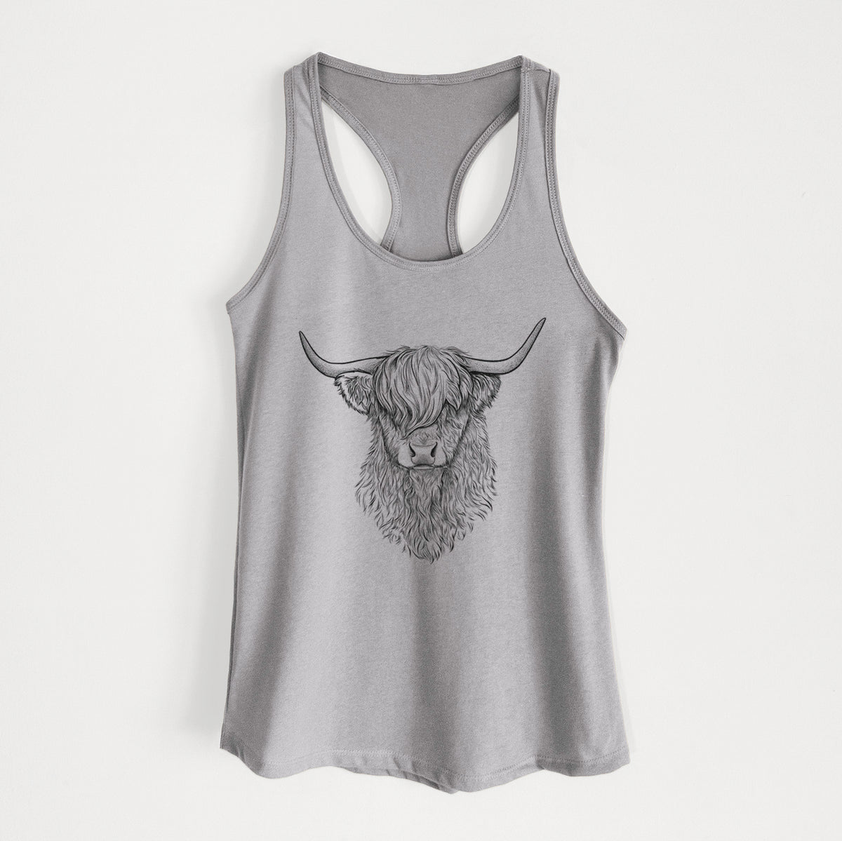 Heather grey women's racerback tank top laid flat, printed with a detailed black ink portrait of a shaggy highland cow with long curved horns.
