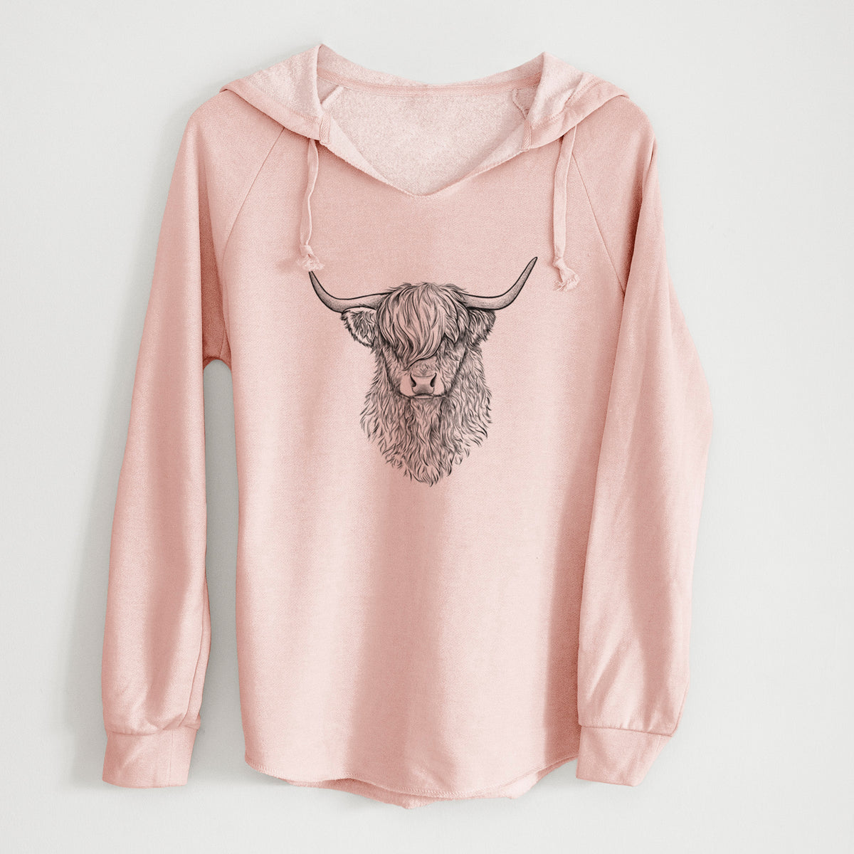 Blush pink women's Cali Wave hooded sweatshirt laid flat, printed with a detailed black ink portrait of a shaggy highland cow with long curved horns.