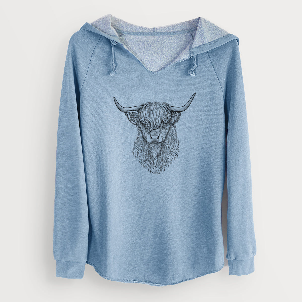 Misty blue women's Cali Wave hooded sweatshirt laid flat, printed with a detailed black ink portrait of a shaggy highland cow with long curved horns.
