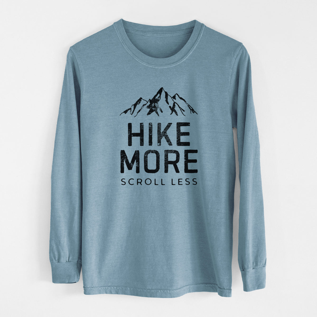Steel blue Comfort Colors long sleeve shirt laid flat, printed with black mountain peaks above the bold words Hike More, Scroll Less.
