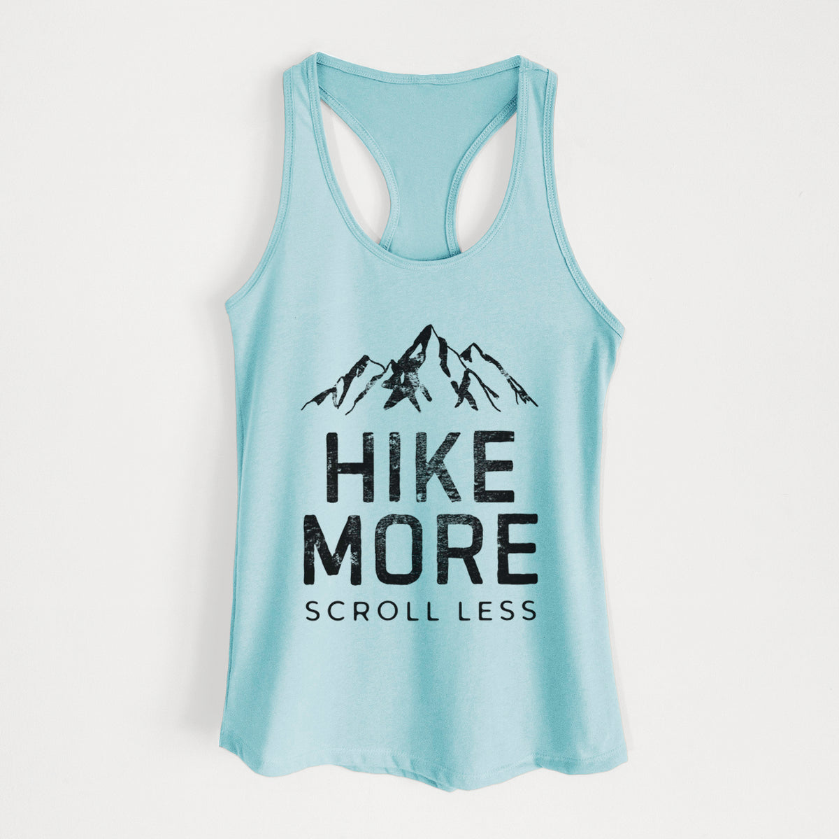 Cancun blue women's racerback tank top laid flat, printed with black mountain peaks above the bold words Hike More, Scroll Less.