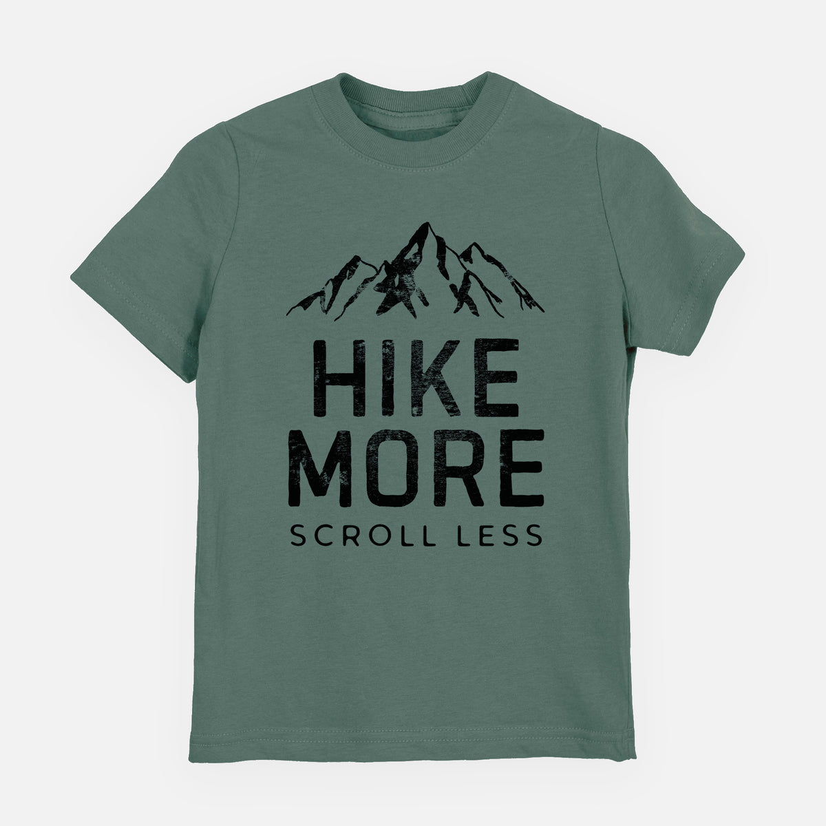 Basil green youth t-shirt laid flat, printed with black mountain peaks above the bold words Hike More, Scroll Less.