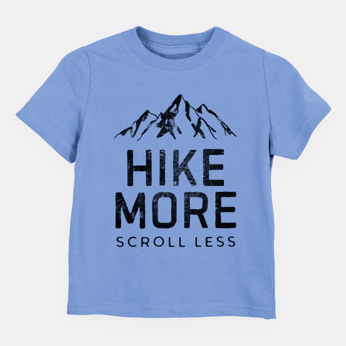 Carolina blue toddler t-shirt laid flat, printed with black mountain peaks above the bold words Hike More, Scroll Less.