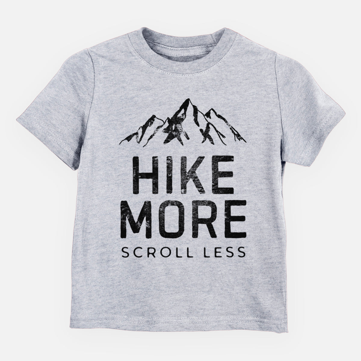 Heather grey toddler t-shirt laid flat, printed with black mountain peaks above the bold words Hike More, Scroll Less.