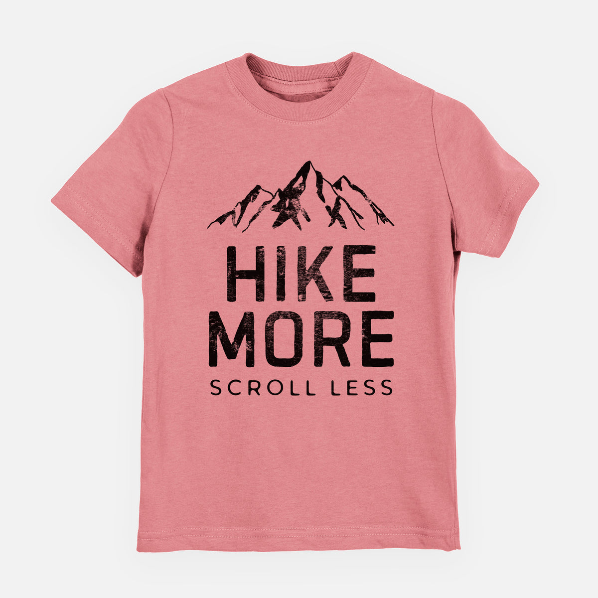 Mauve pink youth t-shirt laid flat, printed with black mountain peaks above the bold words Hike More, Scroll Less.
