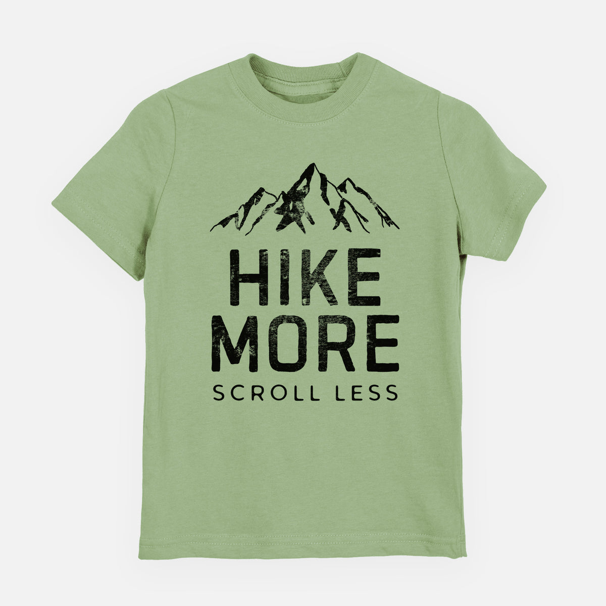 Sage green youth t-shirt laid flat, printed with black mountain peaks above the bold words Hike More, Scroll Less.