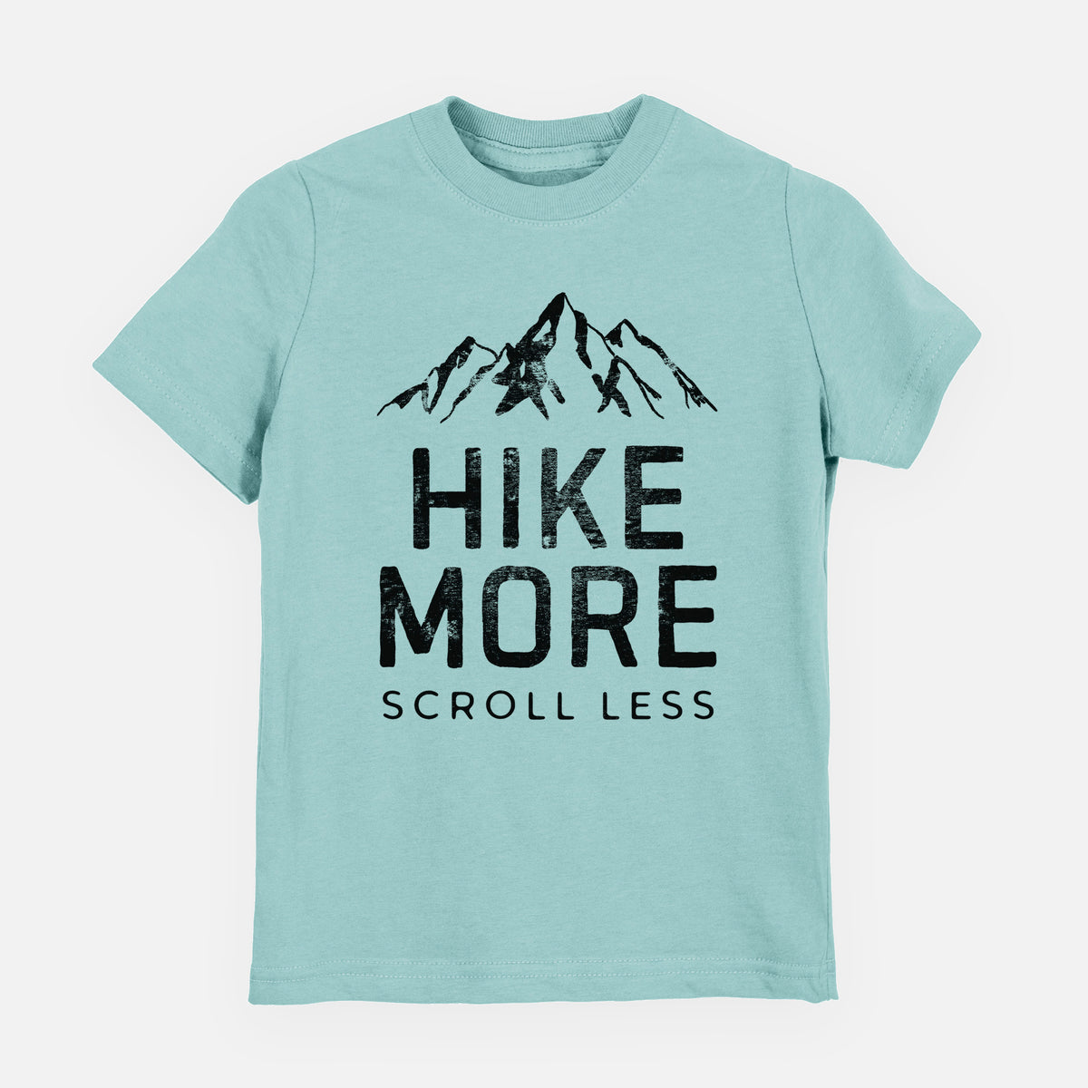 Saltwater youth t-shirt laid flat, printed with black mountain peaks above the bold words Hike More, Scroll Less.