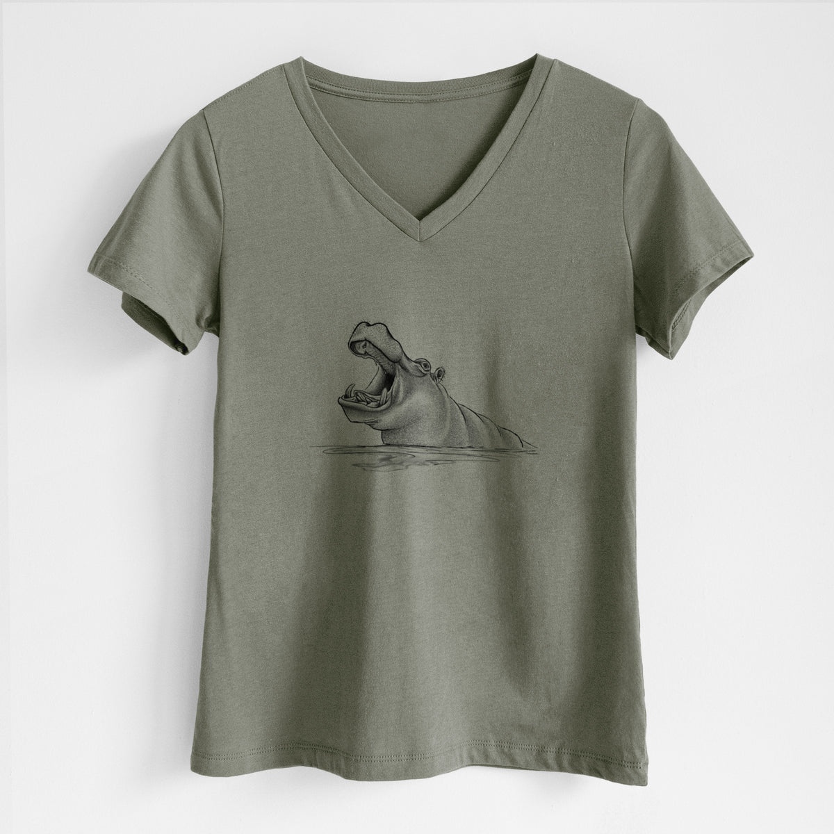 Military green women's relaxed fit cotton V-neck t-shirt laid flat, printed with a black ink illustration of a hippo yawning with its mouth wide open, half submerged in water.