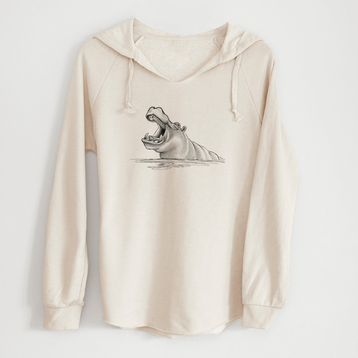 Bone cream women's Cali Wave hooded sweatshirt laid flat, printed with a black ink illustration of a hippo yawning with its mouth wide open, half submerged in water.