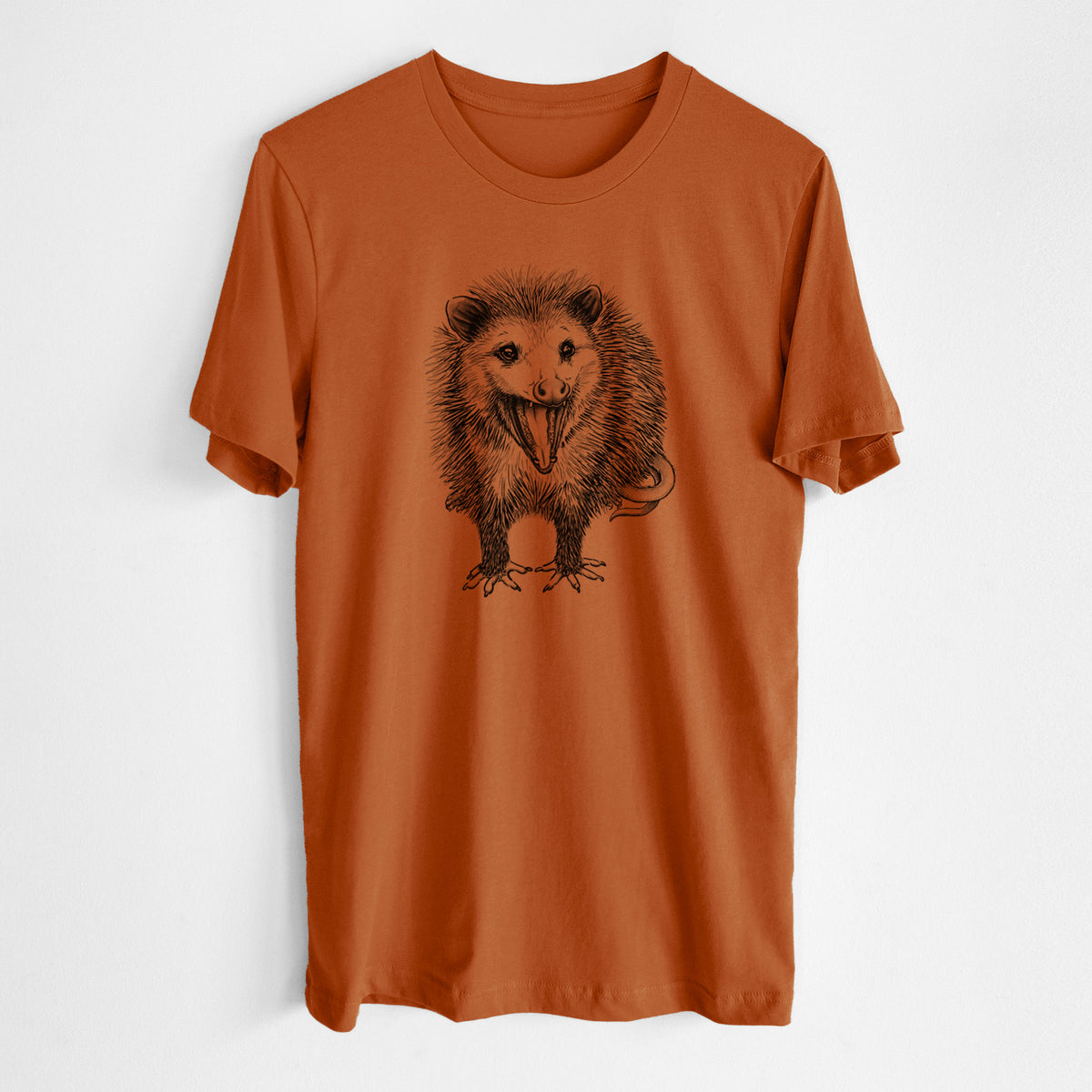 Autumn lightweight cotton t-shirt laid flat, printed with a detailed black ink illustration of an opossum standing and facing forward, mouth open wide in a hiss, with shaggy fur and its tail curled behind.