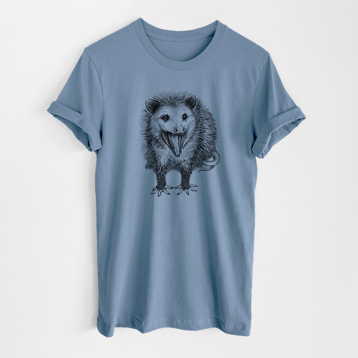 Steel blue lightweight cotton t-shirt laid flat, printed with a detailed black ink illustration of an opossum standing and facing forward, mouth open wide in a hiss, with shaggy fur and its tail curled behind.
