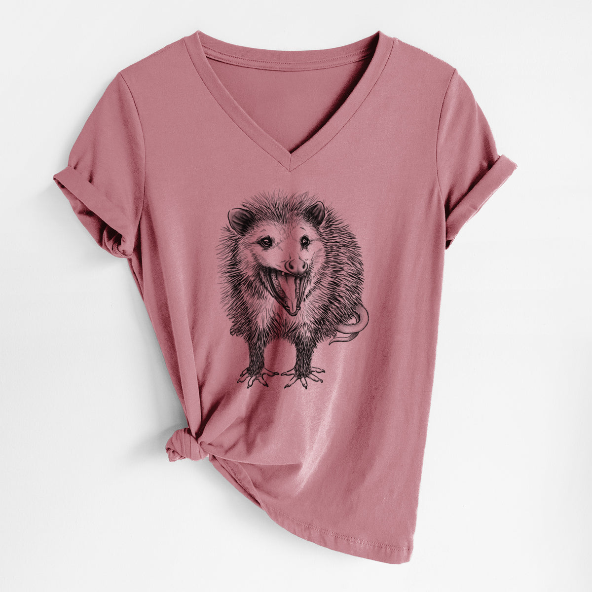 Mauve pink women's relaxed fit cotton V-neck t-shirt laid flat, printed with a detailed black ink illustration of an opossum standing and facing forward, mouth open wide in a hiss, with shaggy fur and its tail curled behind.