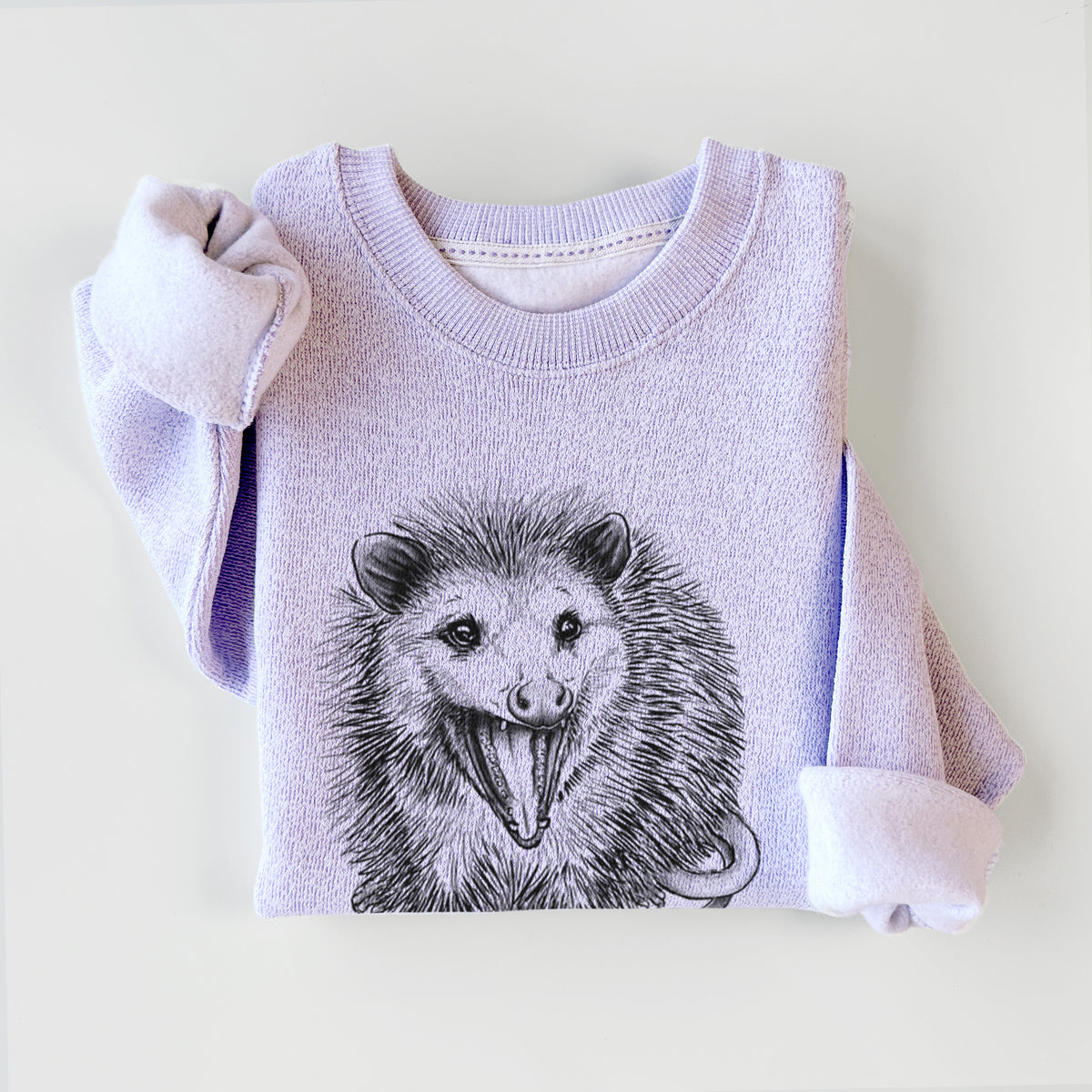 Ice purple knit sweatshirt printed with a detailed black ink illustration of an opossum standing and facing forward, mouth open wide in a hiss, with shaggy fur and its tail curled behind, styled flat.