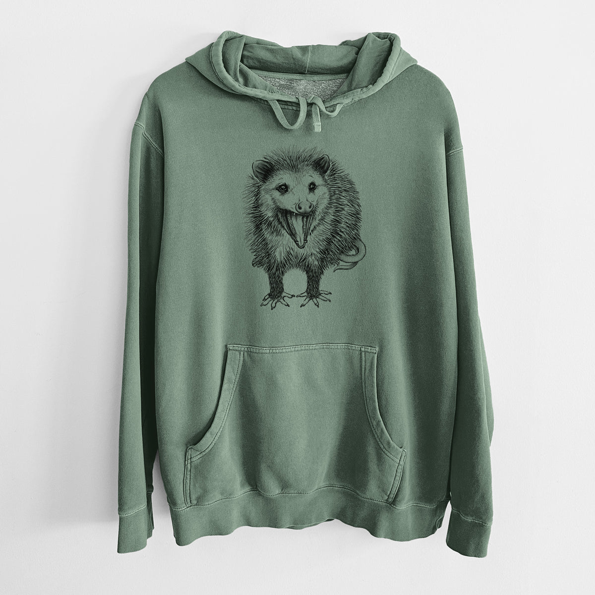 Alpine green pigment dyed hoodie laid flat, printed with a detailed black ink illustration of an opossum standing and facing forward, mouth open wide in a hiss, with shaggy fur and its tail curled behind.