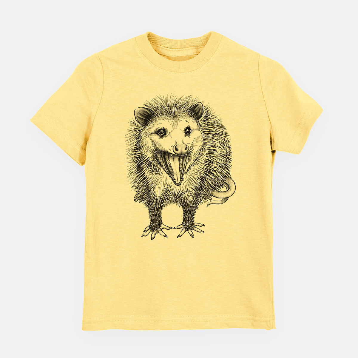 Butter yellow youth t-shirt laid flat, printed with a detailed black ink illustration of an opossum standing and facing forward, mouth open wide in a hiss, with shaggy fur and its tail curled behind.