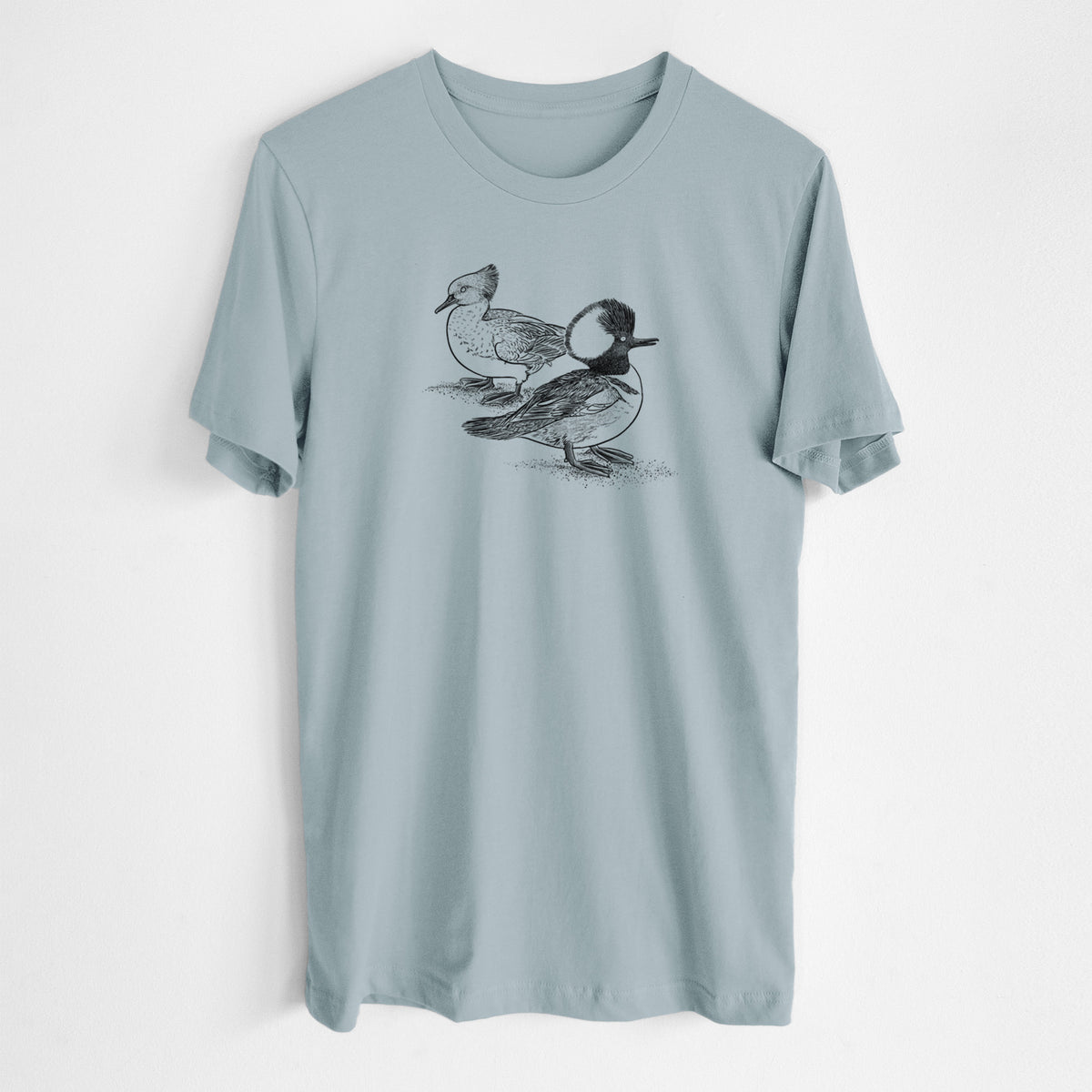 Vintage denim lightweight cotton t-shirt laid flat, printed with a detailed black ink illustration of a pair of hooded mergansers, male and female.