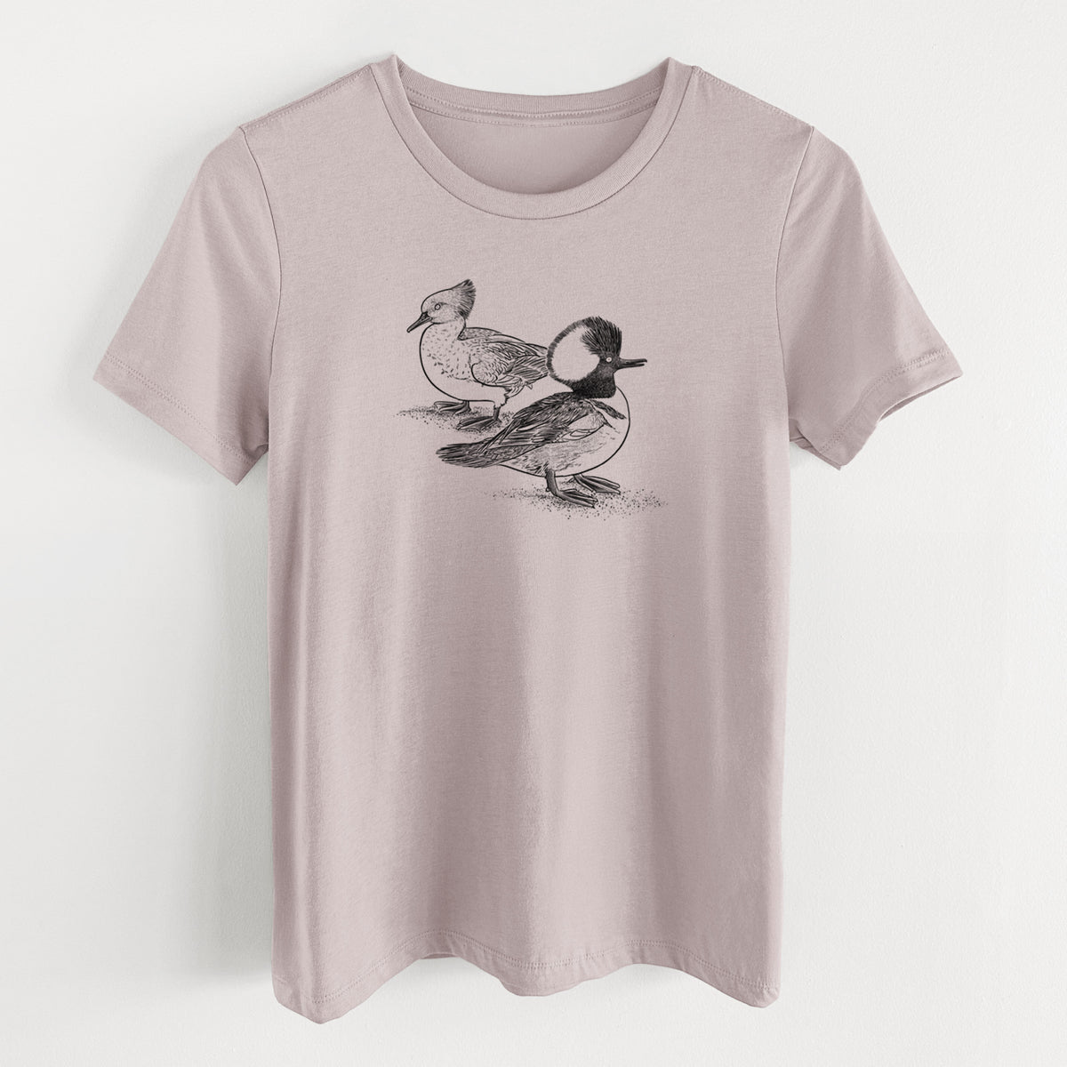 Pink gravel women's relaxed fit cotton t-shirt laid flat, printed with a detailed black ink illustration of a pair of hooded mergansers, male and female.