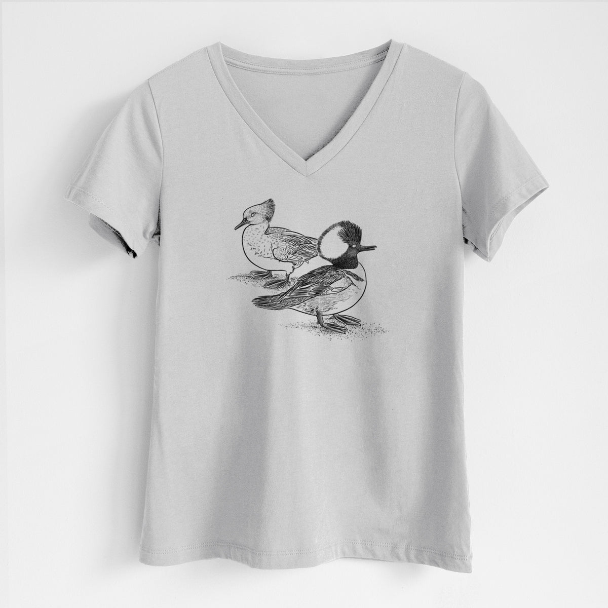 Lunar grey women's relaxed fit cotton V-neck t-shirt laid flat, printed with a detailed black ink illustration of a pair of hooded mergansers, male and female.