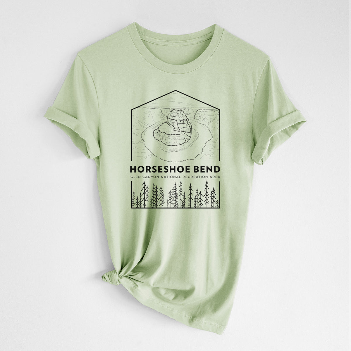 Spring green lightweight cotton t-shirt laid flat with the sleeves rolled, printed with a black line art badge of Horseshoe Bend above pine trees, with the words Horseshoe Bend.