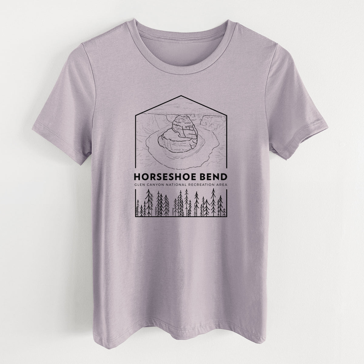 Light violet women's relaxed fit cotton t-shirt laid flat, printed with a black line art badge of Horseshoe Bend above pine trees, with the words Horseshoe Bend.