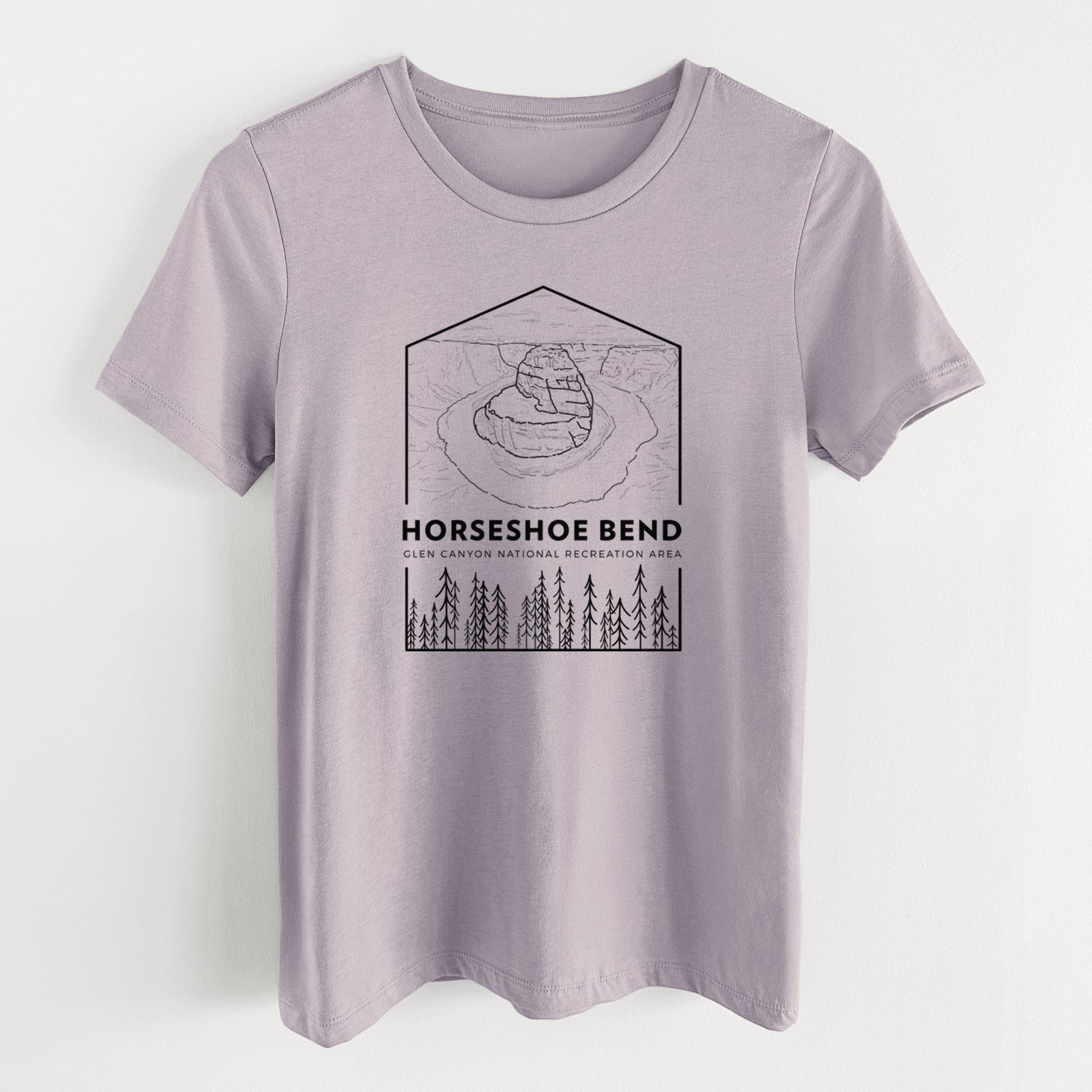 Light violet women's relaxed fit cotton t-shirt laid flat, printed with a black line art badge of Horseshoe Bend above pine trees, with the words Horseshoe Bend.