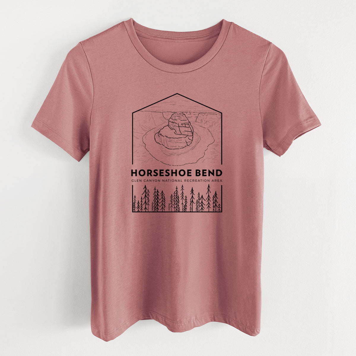 Mauve pink women's relaxed fit cotton t-shirt laid flat, printed with a black line art badge of Horseshoe Bend above pine trees, with the words Horseshoe Bend.