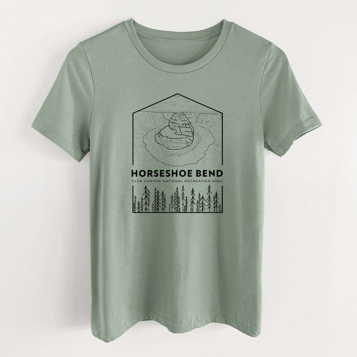 Sage green women's relaxed fit cotton t-shirt laid flat, printed with a black line art badge of Horseshoe Bend above pine trees, with the words Horseshoe Bend.