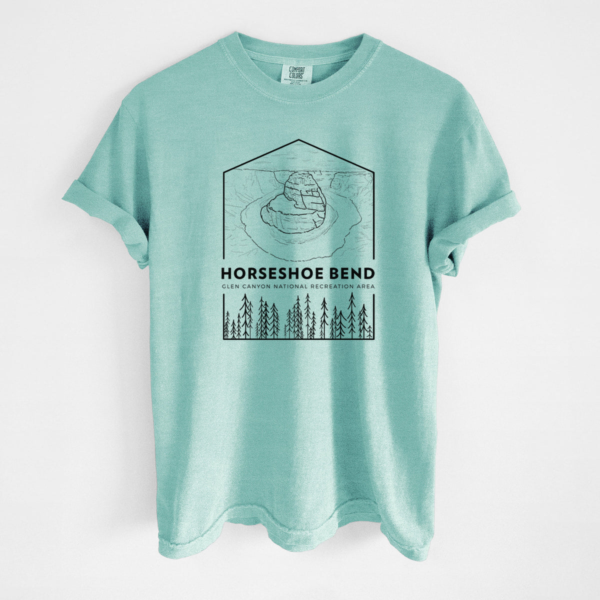 Chalky mint Comfort Colors t-shirt laid flat, printed with a black line art badge of Horseshoe Bend above pine trees, with the words Horseshoe Bend.