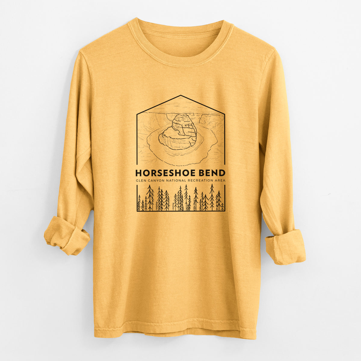 Golden wheat yellow Comfort Colors long sleeve shirt laid flat with the cuffs rolled, printed with a black line art badge of Horseshoe Bend above pine trees, with the words Horseshoe Bend.