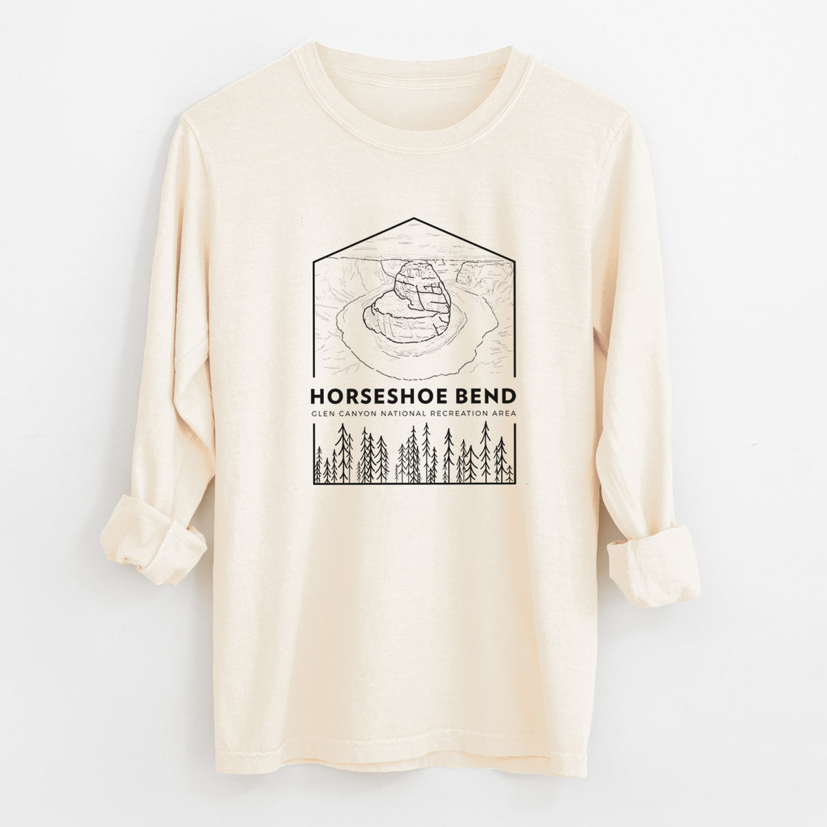 Ivory Comfort Colors long sleeve shirt laid flat with the cuffs rolled, printed with a black line art badge of Horseshoe Bend above pine trees, with the words Horseshoe Bend.