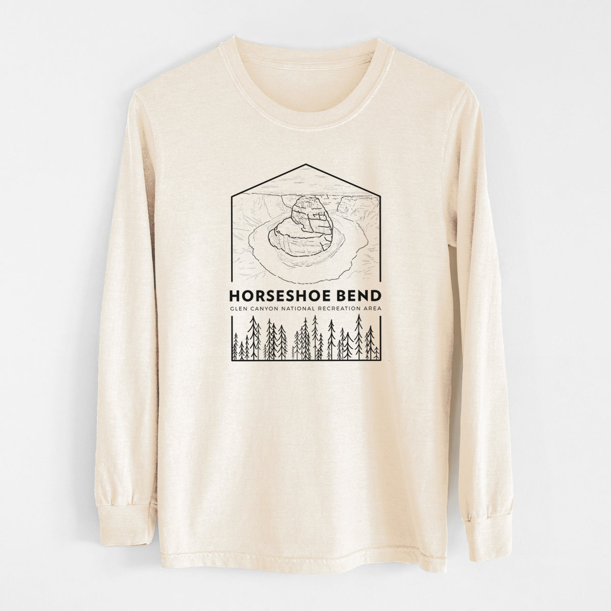 Ivory Comfort Colors long sleeve shirt laid flat, printed with a black line art badge of Horseshoe Bend above pine trees, with the words Horseshoe Bend.
