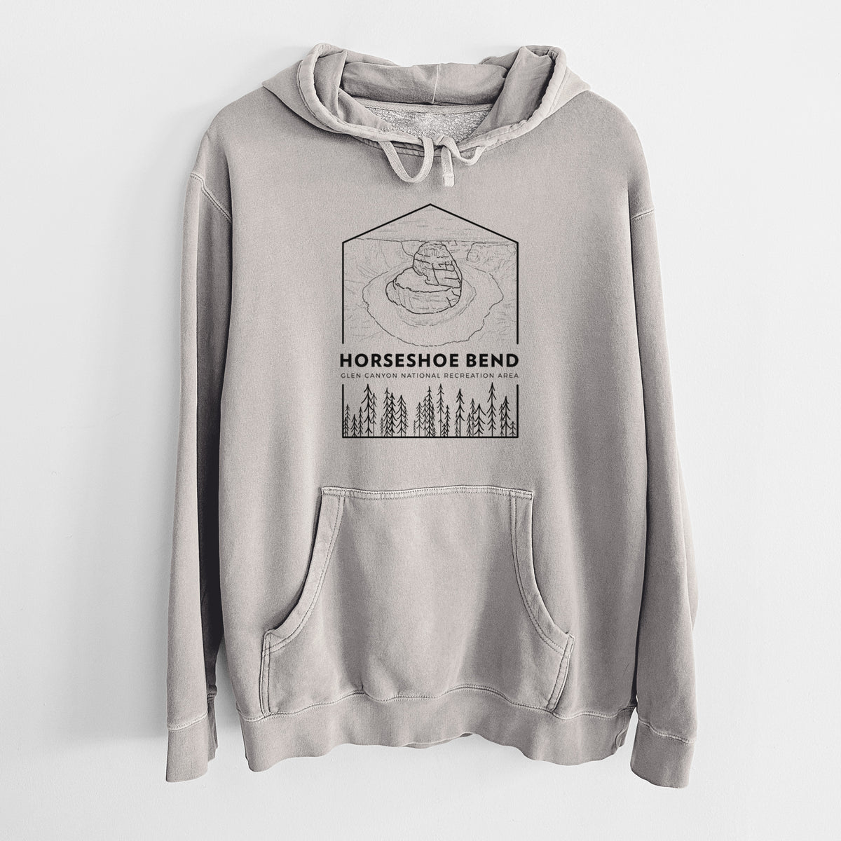 Cement grey pigment dyed hoodie laid flat, printed with a black line art badge of Horseshoe Bend above pine trees, with the words Horseshoe Bend.