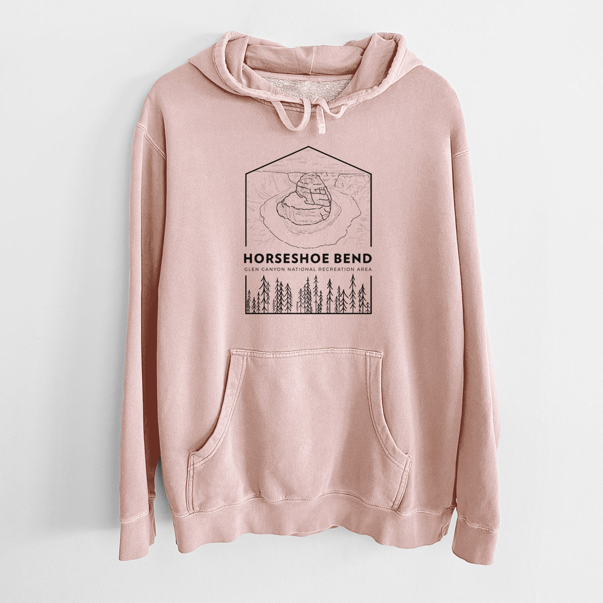 Dusty pink pigment dyed hoodie laid flat, printed with a black line art badge of Horseshoe Bend above pine trees, with the words Horseshoe Bend.