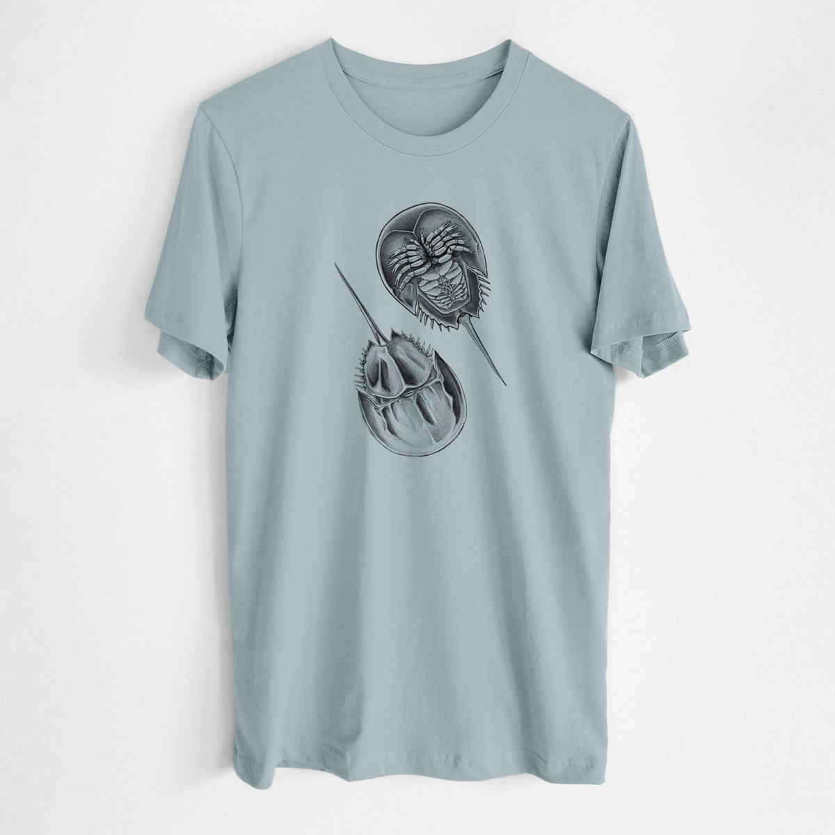 Vintage denim lightweight cotton t-shirt laid flat, printed with a detailed black ink illustration of two horseshoe crabs.