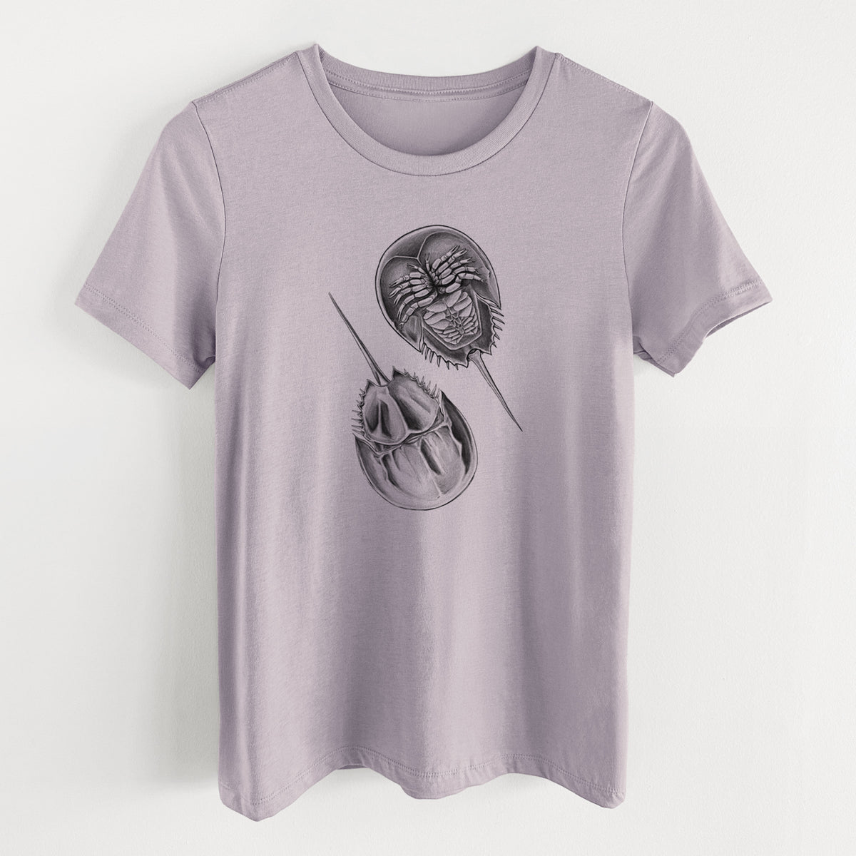 Light violet women's relaxed fit cotton t-shirt laid flat, printed with a detailed black ink illustration of two horseshoe crabs.