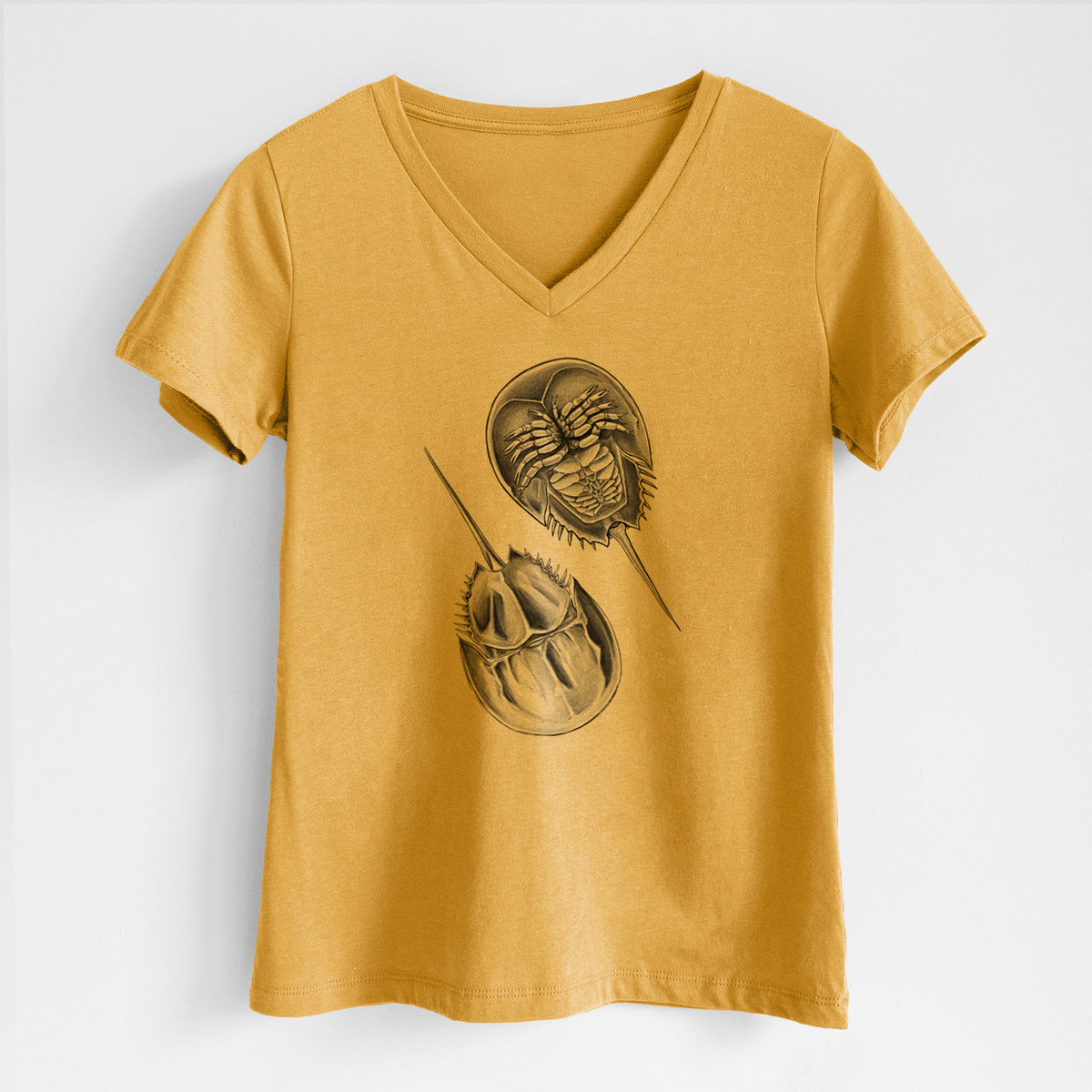 Honeycomb yellow women's relaxed fit cotton V-neck t-shirt laid flat, printed with a detailed black ink illustration of two horseshoe crabs.