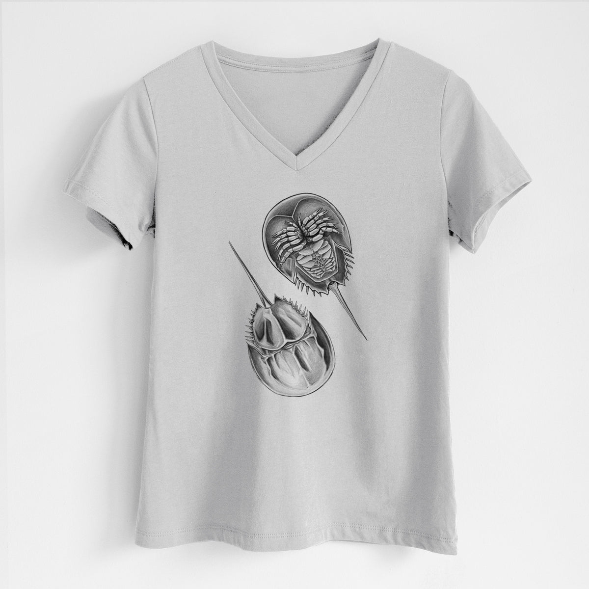 Lunar grey women's relaxed fit cotton V-neck t-shirt laid flat, printed with a detailed black ink illustration of two horseshoe crabs.