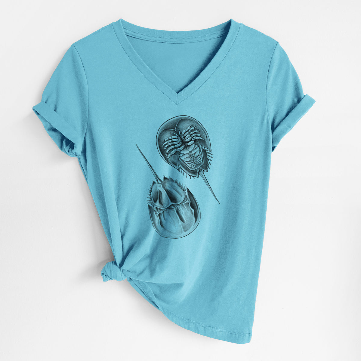 Turquoise women's relaxed fit cotton V-neck t-shirt laid flat, printed with a detailed black ink illustration of two horseshoe crabs.