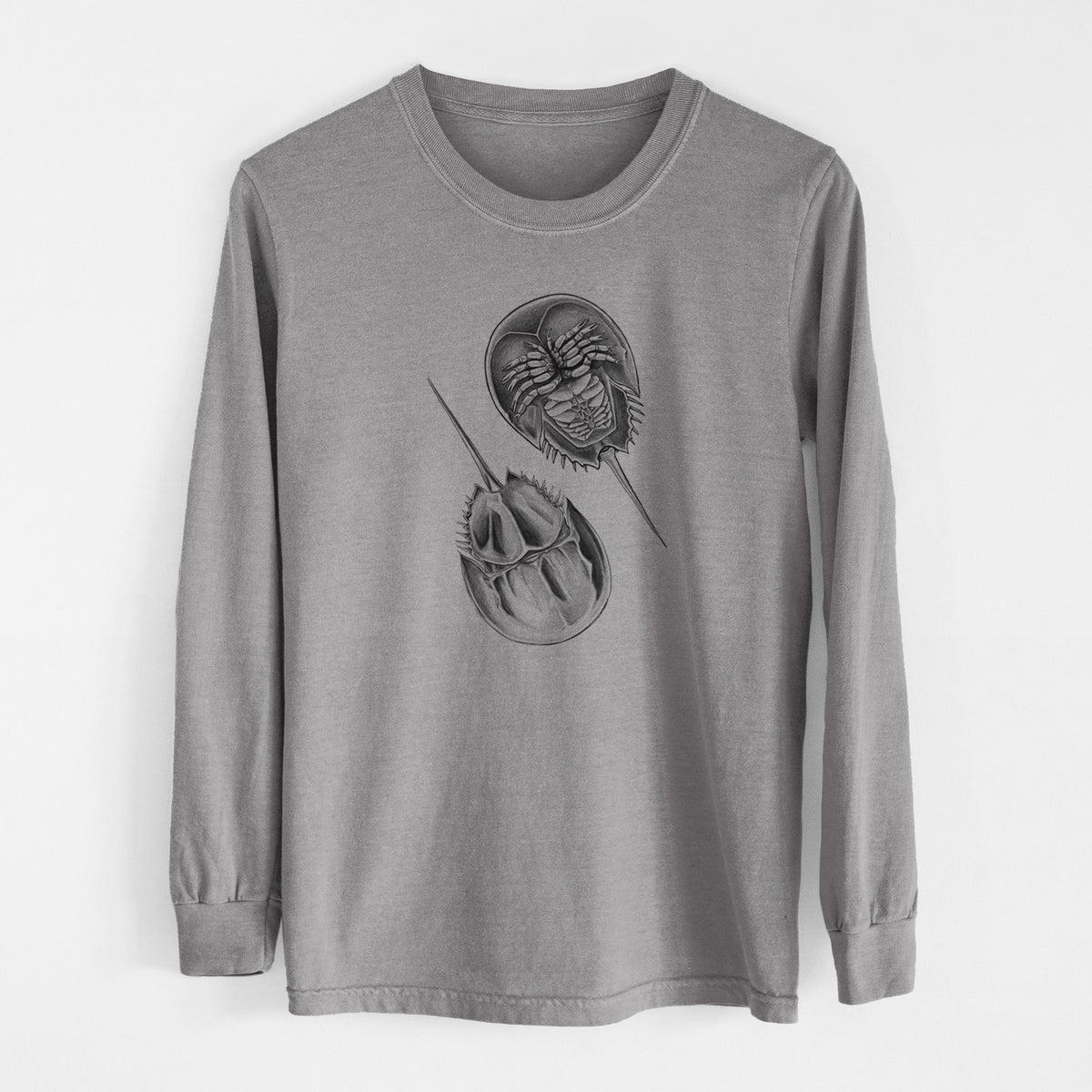 Grey Comfort Colors long sleeve shirt laid flat, printed with a detailed black ink illustration of two horseshoe crabs.