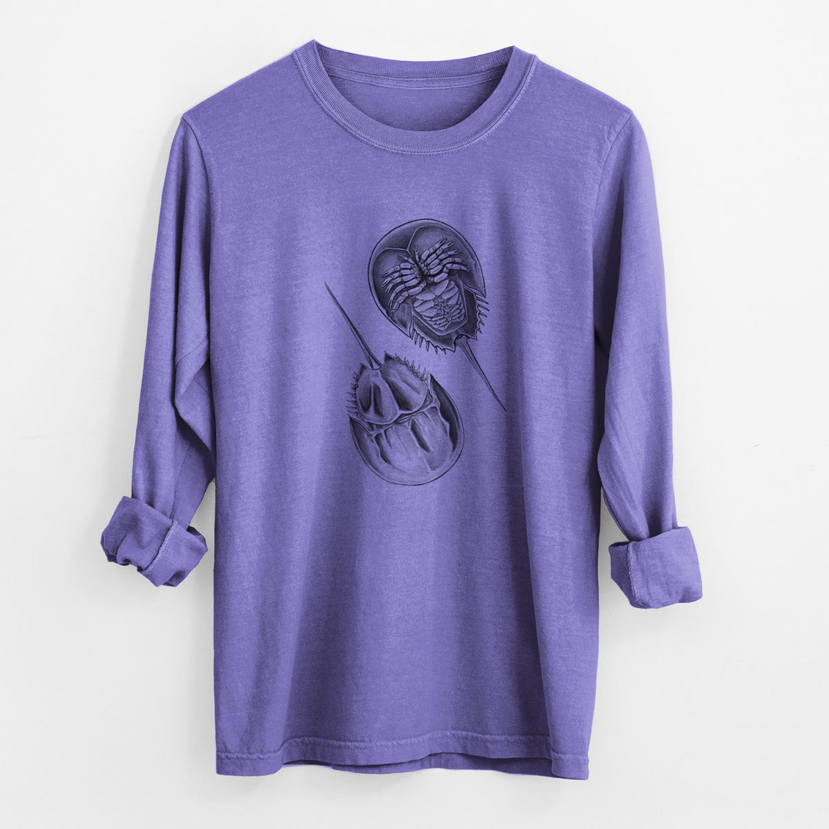 Violet purple Comfort Colors long sleeve shirt laid flat with the cuffs rolled, printed with a detailed black ink illustration of two horseshoe crabs.