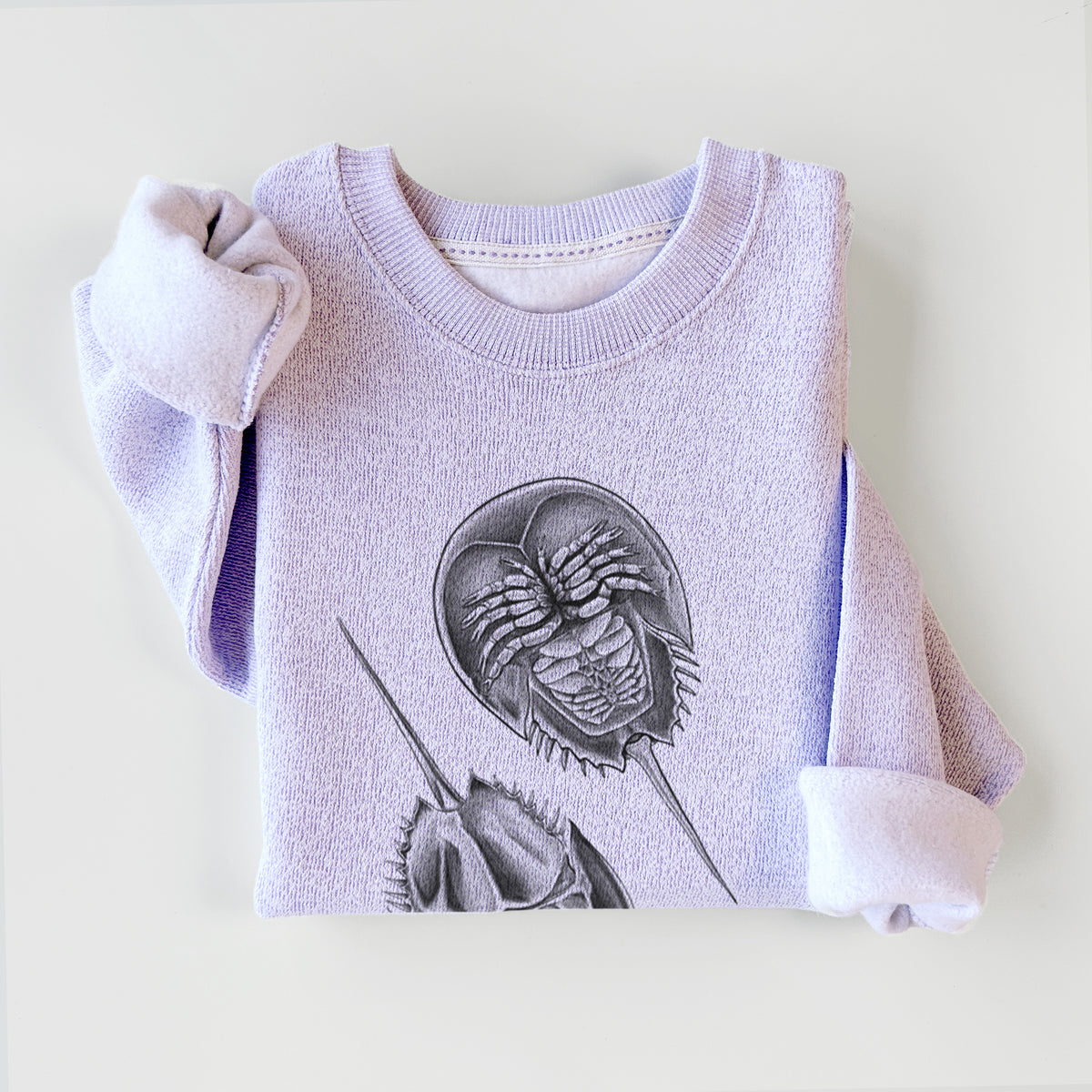 Ice purple knit sweatshirt printed with a detailed black ink illustration of two horseshoe crabs, styled flat.