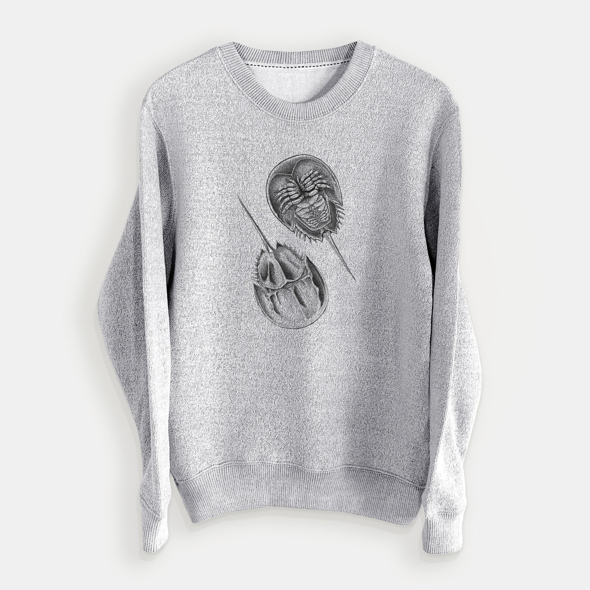 Salt and pepper knit sweatshirt laid flat, printed with a detailed black ink illustration of two horseshoe crabs.