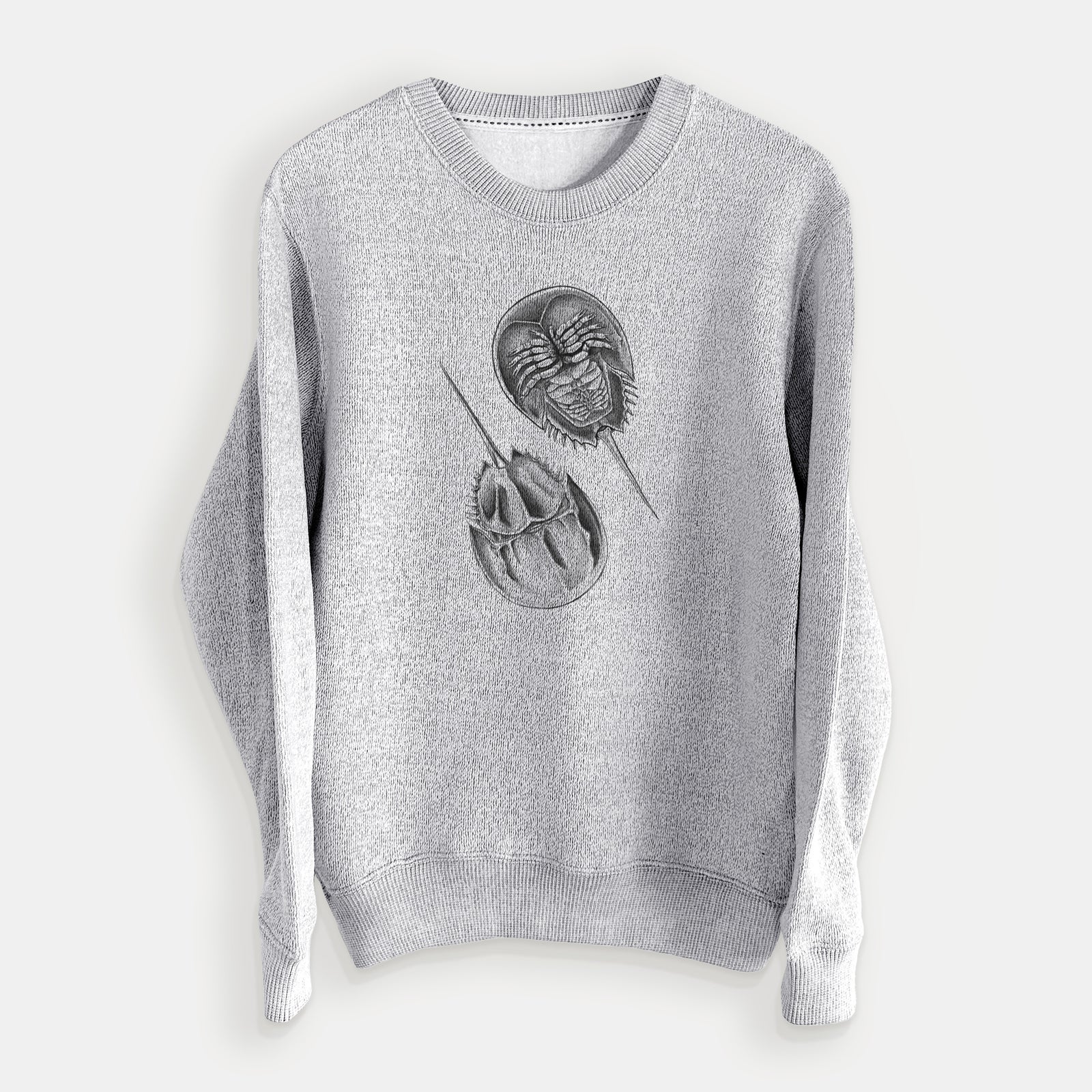 Salt and pepper knit sweatshirt laid flat, printed with a detailed black ink illustration of two horseshoe crabs.