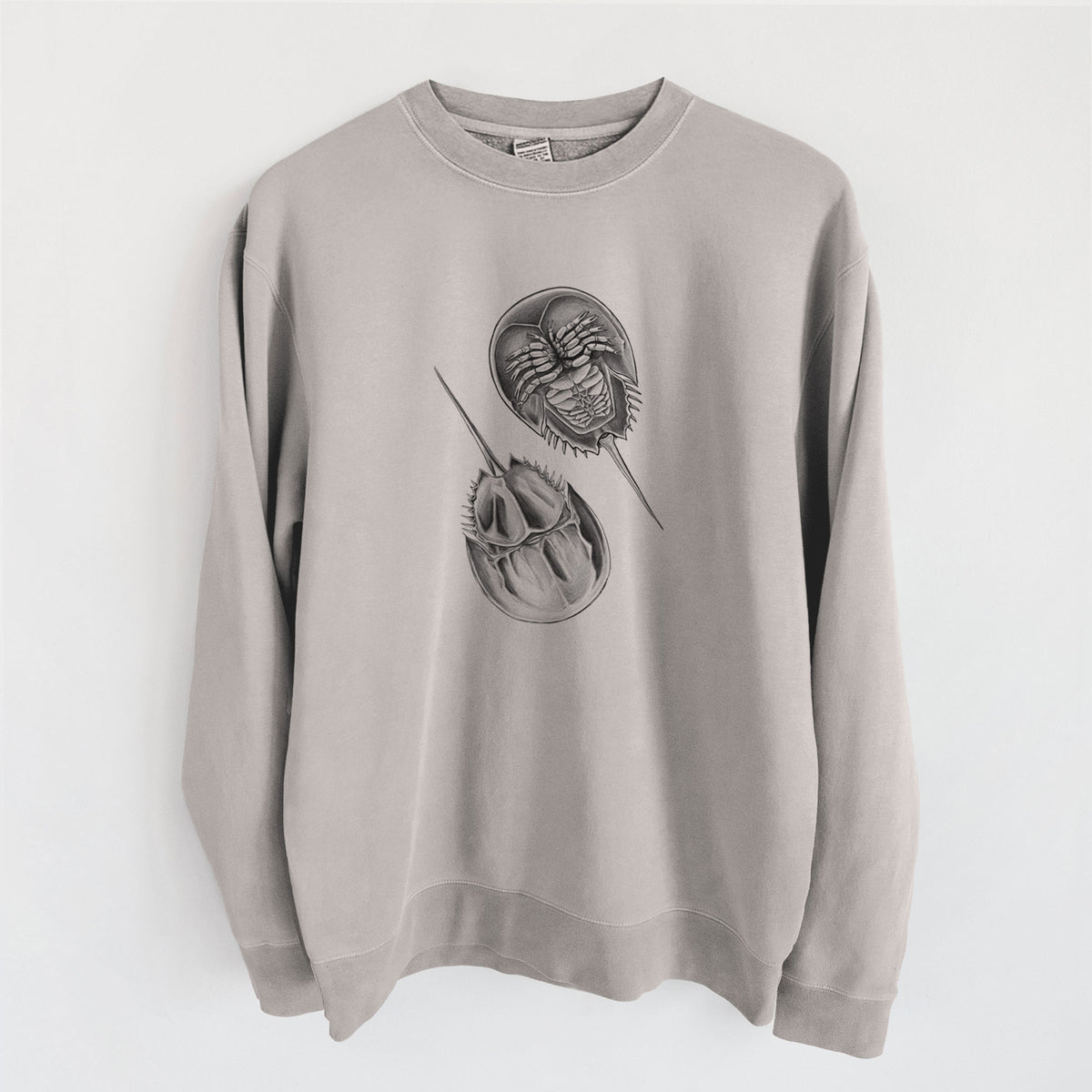 Cement grey pigment dyed crewneck sweatshirt laid flat, printed with a detailed black ink illustration of two horseshoe crabs.