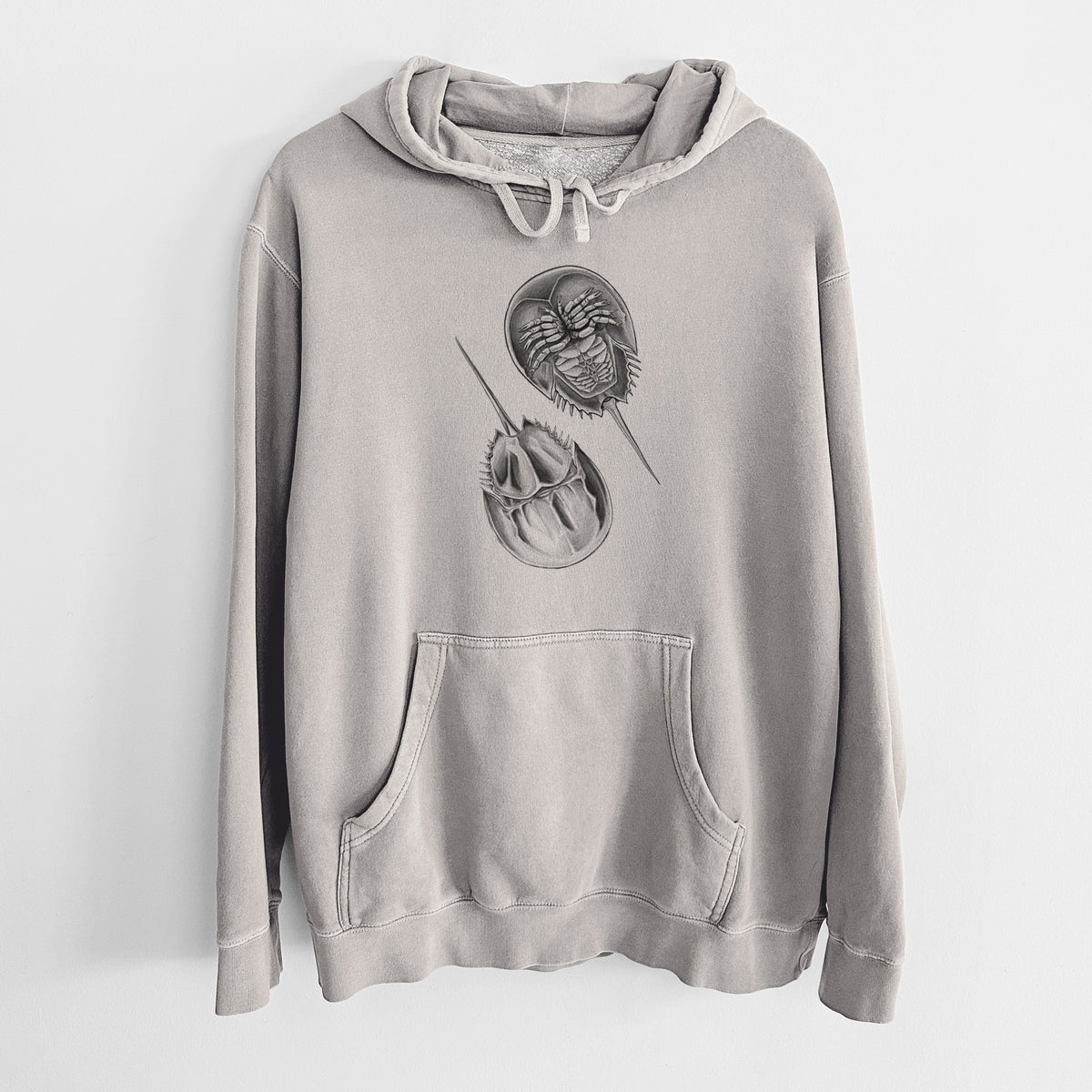 Cement grey pigment dyed hoodie laid flat, printed with a detailed black ink illustration of two horseshoe crabs.