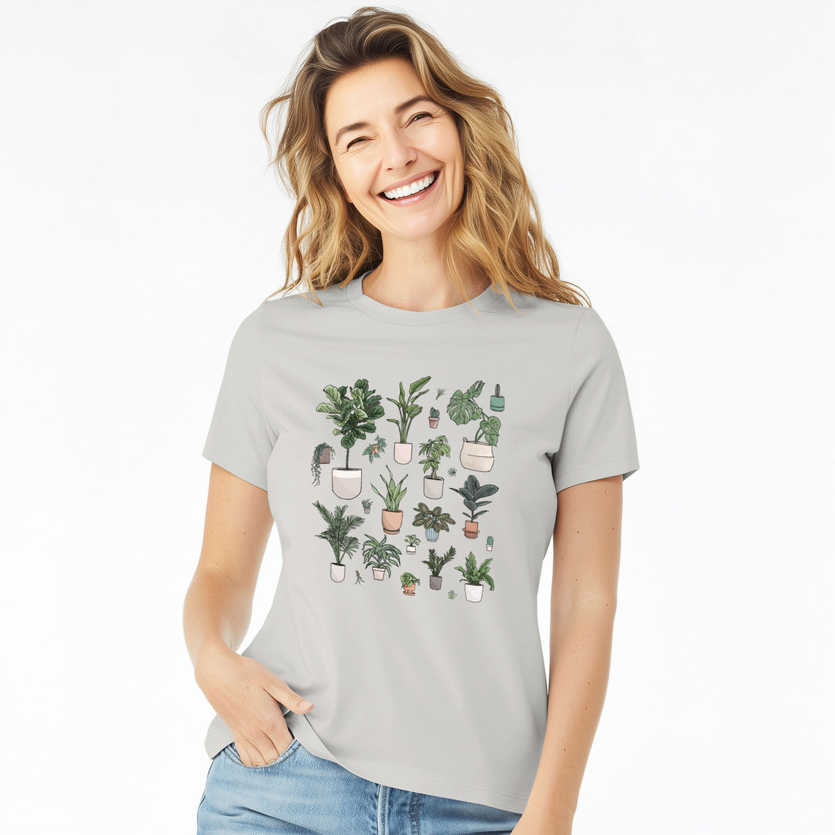 Woman wearing a lunar grey women's relaxed fit cotton t-shirt printed with a full-color collection of potted houseplants in different pots.