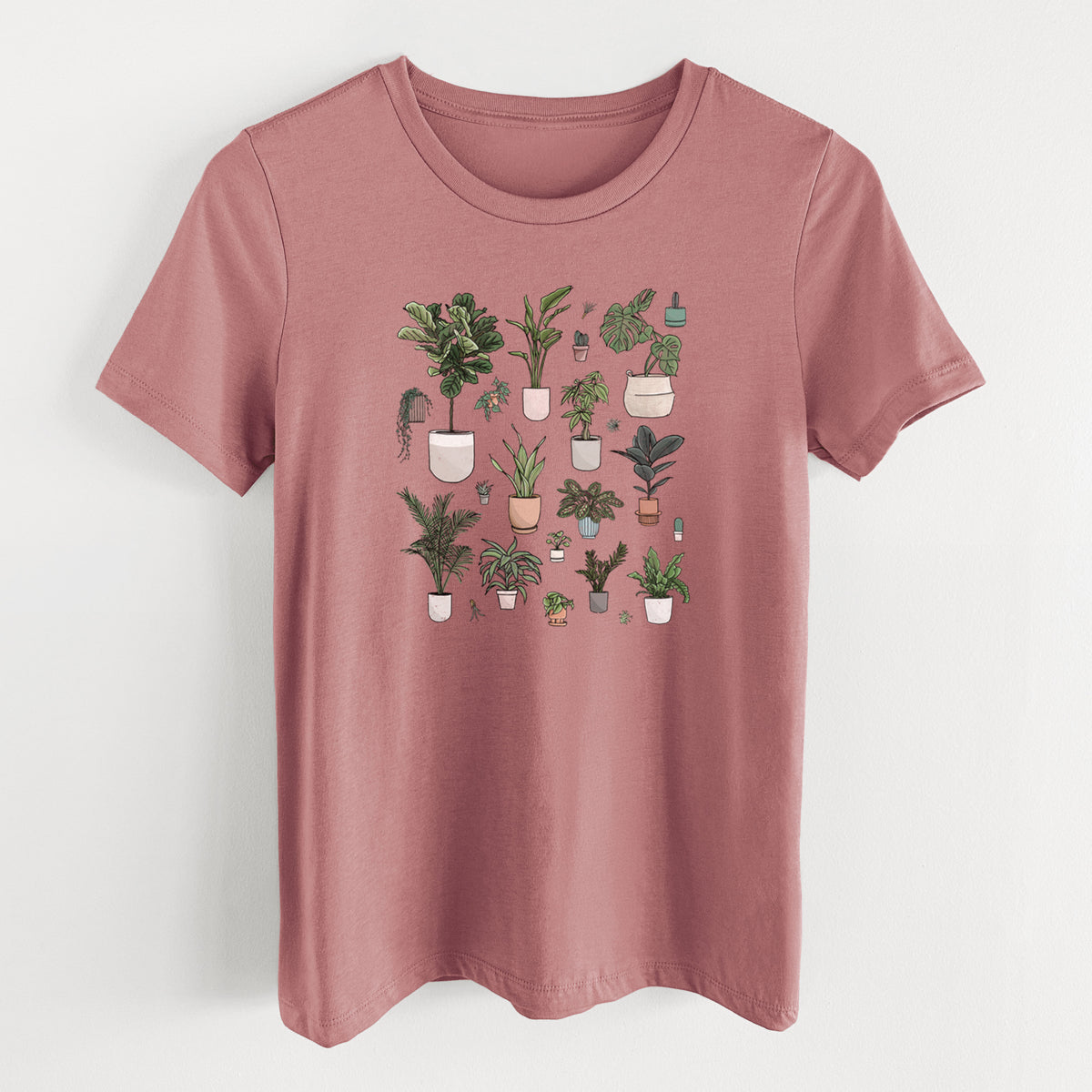 Mauve pink women's relaxed fit cotton t-shirt laid flat, printed with a full-color collection of potted houseplants in different pots.