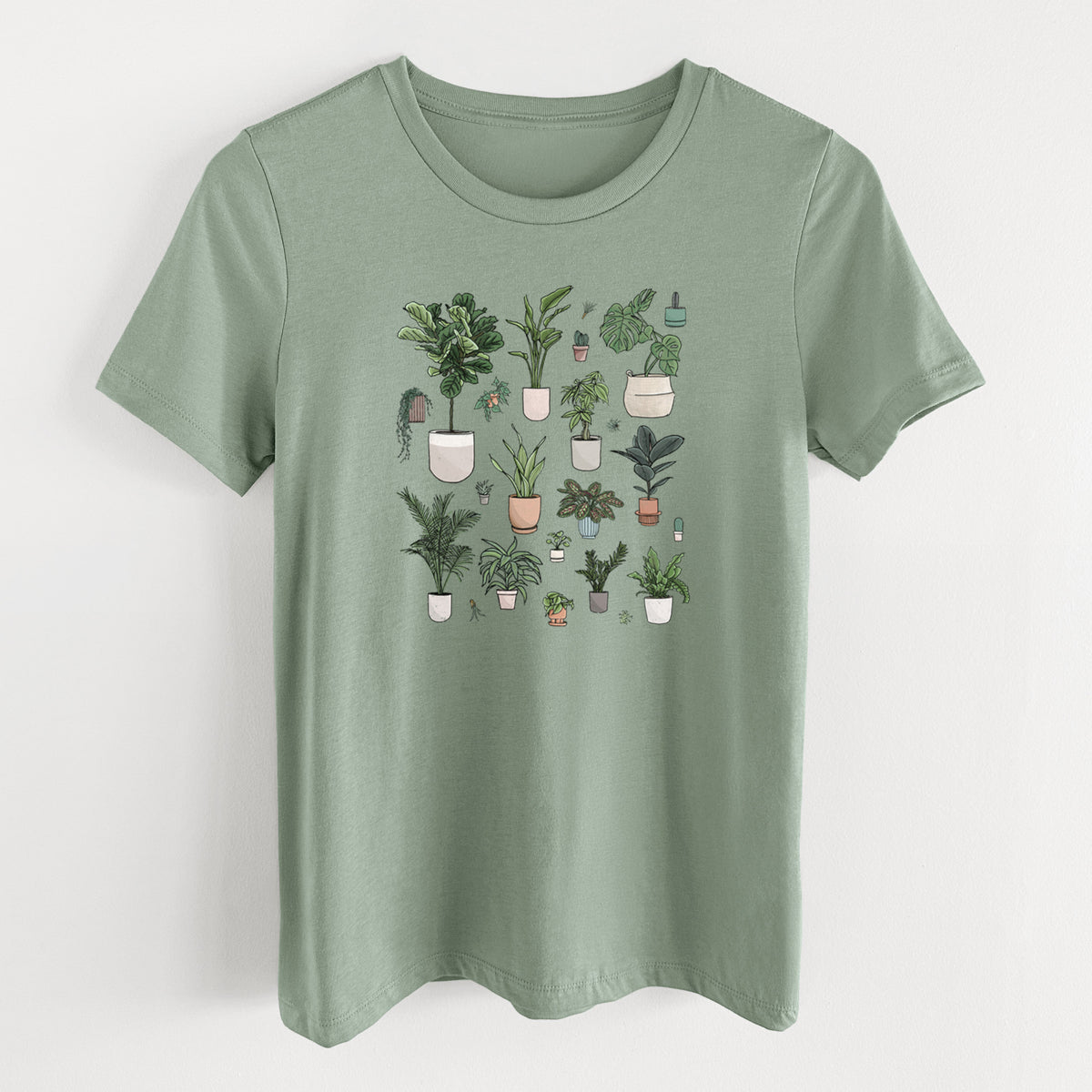 Sage green women's relaxed fit cotton t-shirt laid flat, printed with a full-color collection of potted houseplants in different pots.