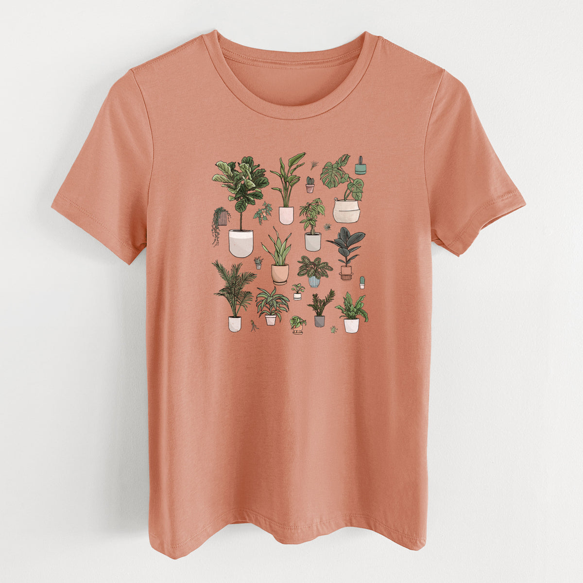 Terracotta orange women's relaxed fit cotton t-shirt laid flat, printed with a full-color collection of potted houseplants in different pots.